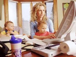 The lady is doing the performance blogging system while taking care of her two babies.